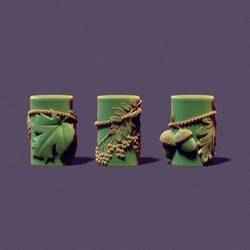 Set of three autumn candles with maple leaves, acorns and mountain ash