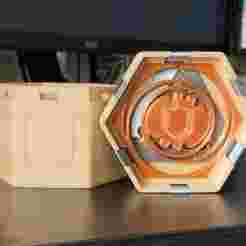 Merged spring with visible cogwheel and shield engravings